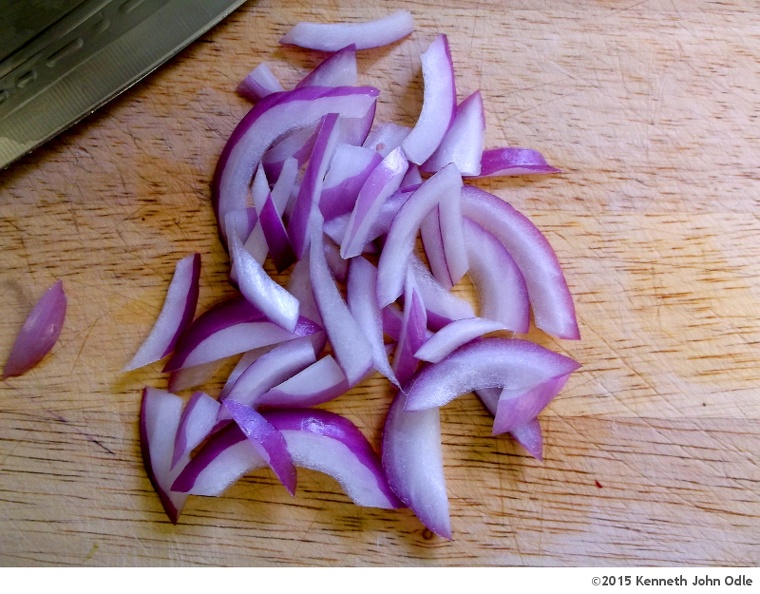 sliced-red-onions-with-blade.jpg